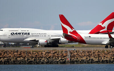 Illustrative: Two Qantas planes taxi on the runway at Sydney Airport. Photo: Rick Rycroft/AP